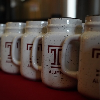Temple-branded beer mugs.