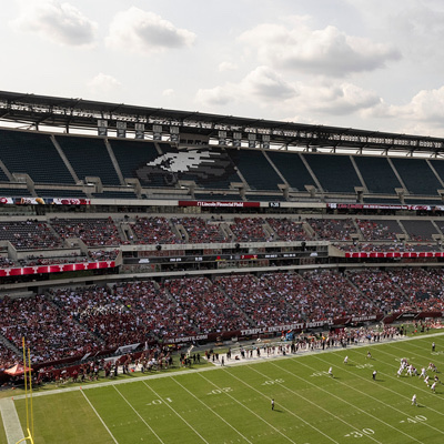 A football stadium with fans in the stands.