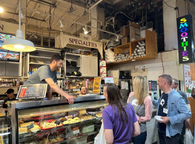 People place an order at a food stall.
