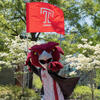 Hooter runs with a Temple Flag.